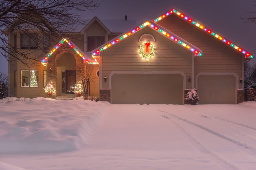 Winter Home with Holiday Lights and Tracks